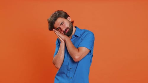 Sleepy Man Yawns and Pretends to Sleep