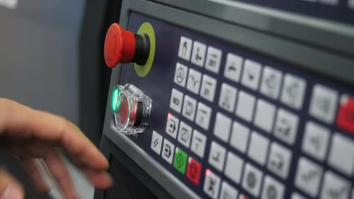 Closeup Pressing Buttons of Machine Control Panel Media Starting Production Machine Using Control