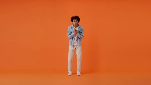 Curly Man Doing Winner Gestures and Screaming of Happiness