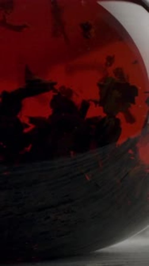 Vertical of Classic Transparent Teapot for Brewing with Fragrant Tea Inside