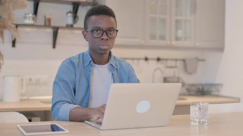 Young Man Working At His Computer