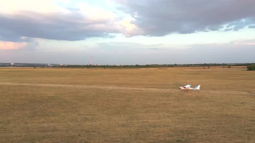 Small Airplane Riding Along Rural Runway Before the Takeoff Light Aircraft Heading Towards Airstrip