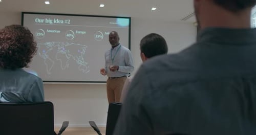 Professional Man Giving a Presentation to Colleagues
