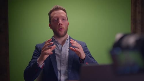 Dynamic Speaker in a WellDesigned Studio with Green Screen for Engaging Visuals
