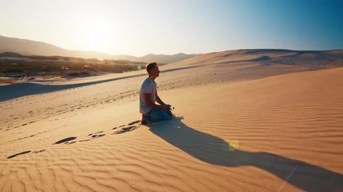 Tired lonely man struggles in the desert with empty bottle of water