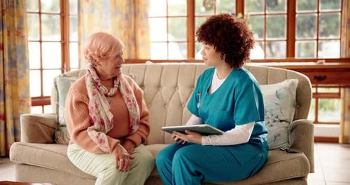 Healthcare Worker Visiting Senior Woman at Home