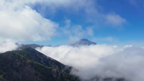 Aerial of Teide National Park and Volcano Mount Teide Above White Clouds