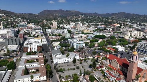Drone flying over the Hollywood cityscape, sunny day in Los Angeles, USA