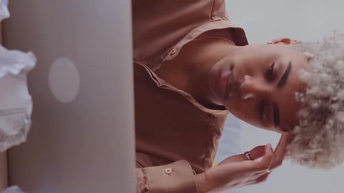 Young Tired African American Woman Doing Work on Laptops and Feeling Exhaustion
