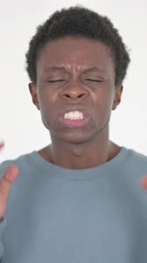 Frustrated Young Man Shouting and Gesturing Aggressively