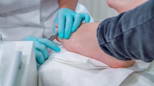 Adult Receiving Professional Pedicure Close Up