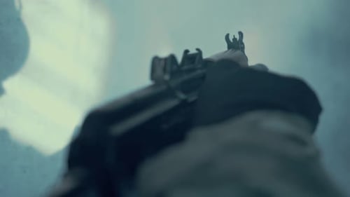 Low Angle Shot of an Assault Rifle in Smoke