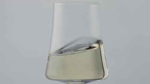 Wine Glass with White Wine Waves and Ripples