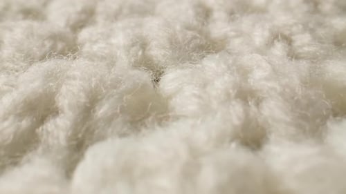 Close-Up of Off-White Knitted Wool Texture