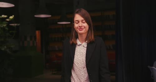 Confident Young Professional Woman Posing with Arms Crossed