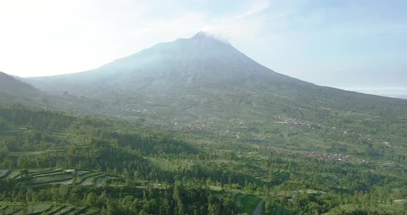aerial view of the marapi volcano and the rural land around it with ...