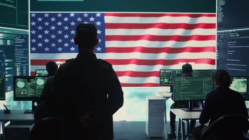 US Military Man Supervising Threat Detection Activity in High Tech Office