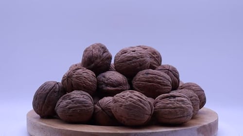 Walnuts rotating on a turntable. Turning walnuts.