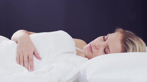 Woman Sleeping Peacefully in Bed, Close Up