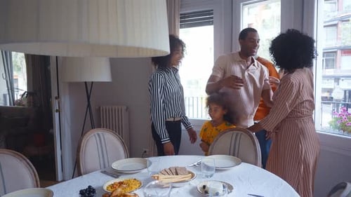 Family Gathering Together at Dining Table