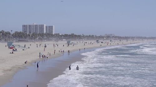 A busy santa monica beach in Los Angeles, California. Slow motion.