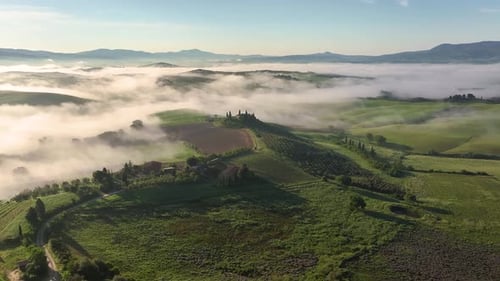 Aerial view of Tuscany landscape with fog, Italy.