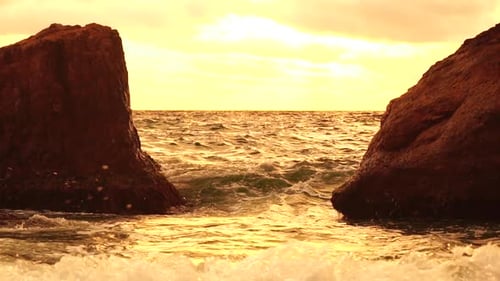 Sea Horizon Line with Waves on Golden Sunset
