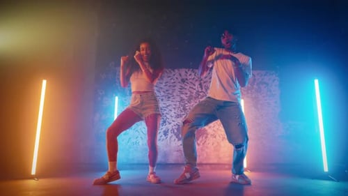 Rehearsing Contemporary Choreography in Dance Studio with Vibrant Atmosphere Fulllength Portrait of