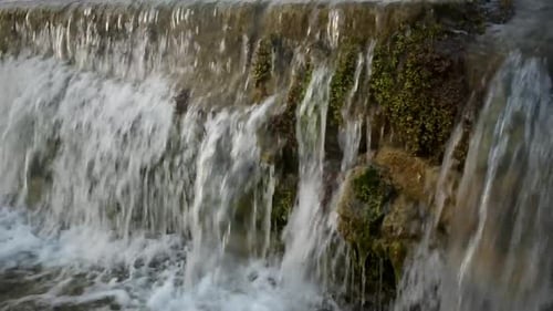 Catching a waterfall in a small freshwater channel.