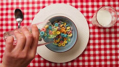 Pouring Milk and Cereal in the Morning
