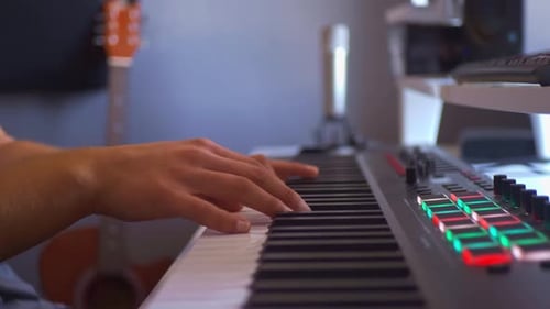 Close Up of Hands Playing Keyboard Instrument