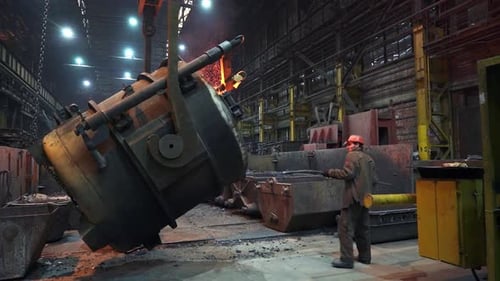 Industrial Foundry Operation Involves Safely Working with Molten Metal for Various Applications