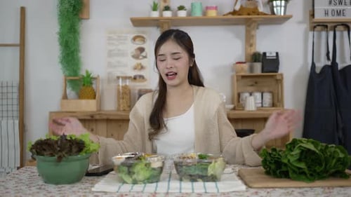 Woman Presents Two Salad Bowls in Kitchen