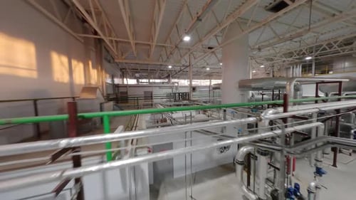 Corrugated Cardboard Plant Interior with Tanks and Piping