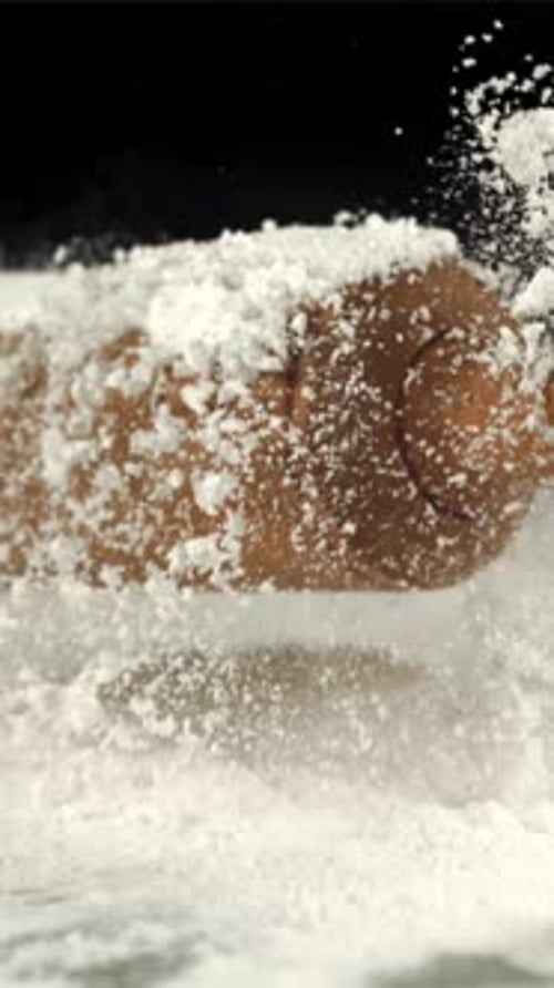 Super Slow Motion of the Rolling Pin Falls on the Table with Flour Filmed on a Highspeed Camera at