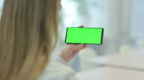 Woman Holding Smartphone with Green Screen Chroma Key