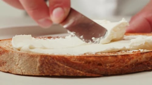 Spreading Cream Cheese on Toast, Close Up