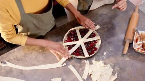 Friends Making Homemade Cherry Pie Together