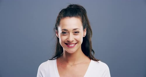 Young Woman Smiling and Winking at Camera