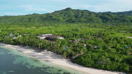 Aerial View of Tropical Peninsula Off Coast of Which There are Boats and Small Restaurant with Green