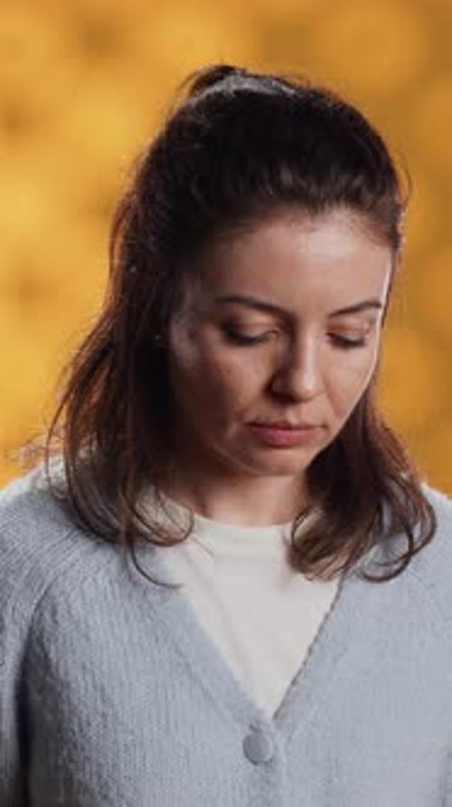 Vertical Video Portrait of Radiant Woman Posing Feeling Happy Studio Background