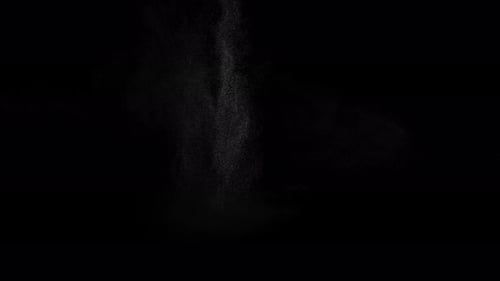 Sahara Collection: Sand falling slowly from the top to the center over a black background shot at 12