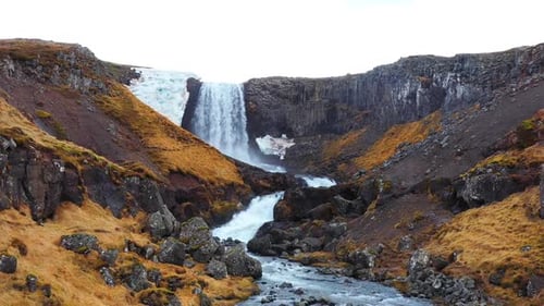 Huge Scenic Waterfall in Iceland Pure Glacier River in Mountains Autumn Colours Aerial View