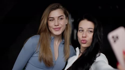 Two Young Women Posing for a Selfie
