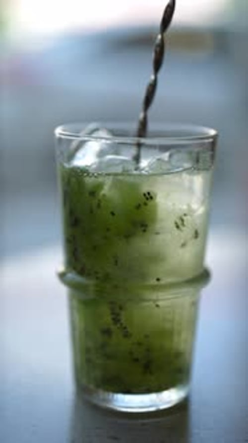 Vertical Cropped Shot of Unrecognizable Bartender Stirring Alcoholic Cocktail with Bar Spoon on