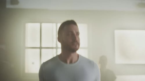 Man Jump Roping in Smoky Training Gym