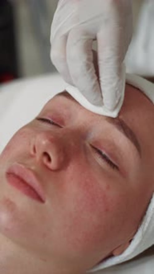 Woman Receiving Forehead Cleanse Close Up