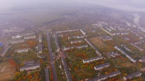 Hazy view of urban landscape on dull autumn day.