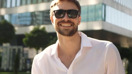 Handsome Man Smiling and Posing in City
