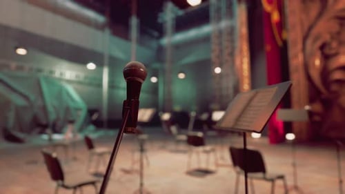 Dramatic Stage View with Microphone and Shifting Lights